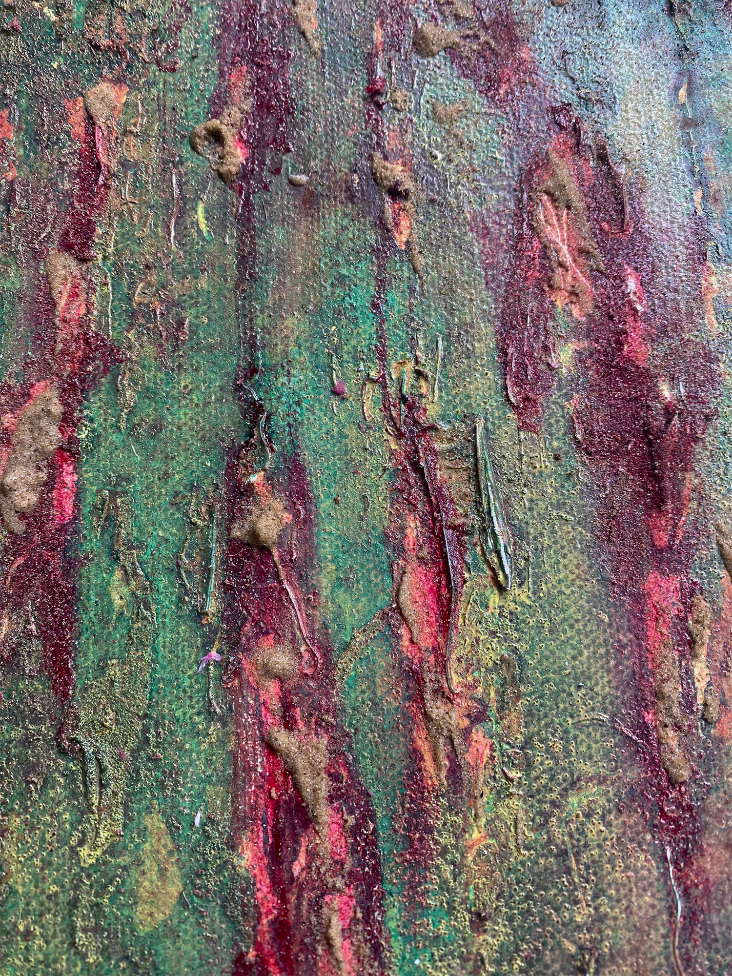 Detail of acrylic and sand on abstract painting about land use and exploitation of ecosystems